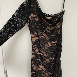 Bebe Size M black dress with tan lining